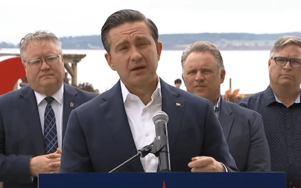 Pierre Poilievre speaking at a press conference