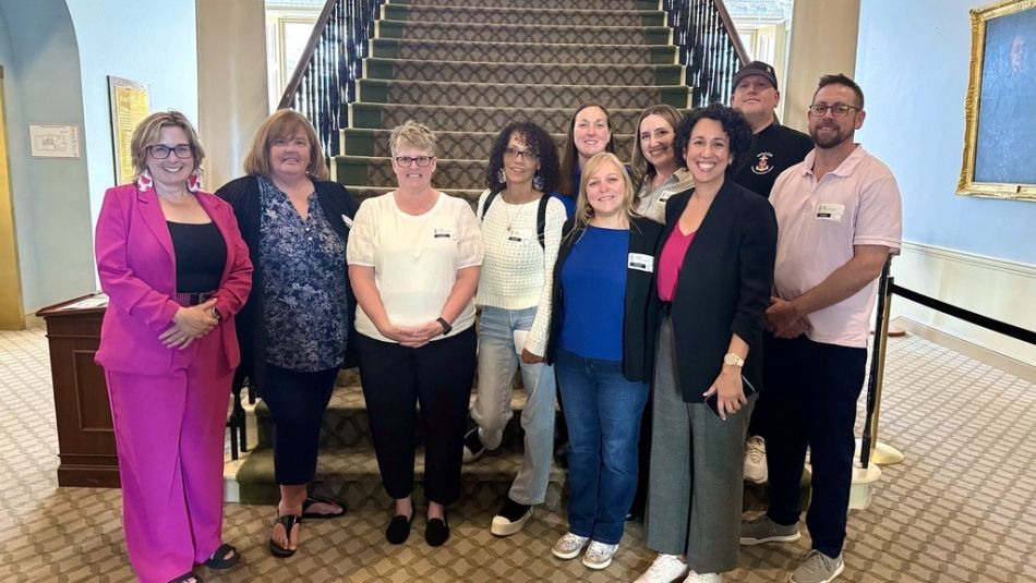 Advocates gathered as intimate partner violence legislation passes