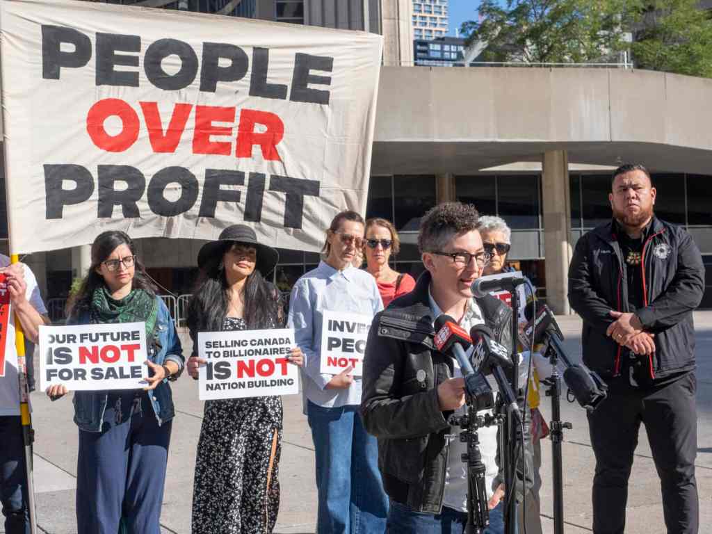 Protesters outside the Canada Investment Summit in Toronto