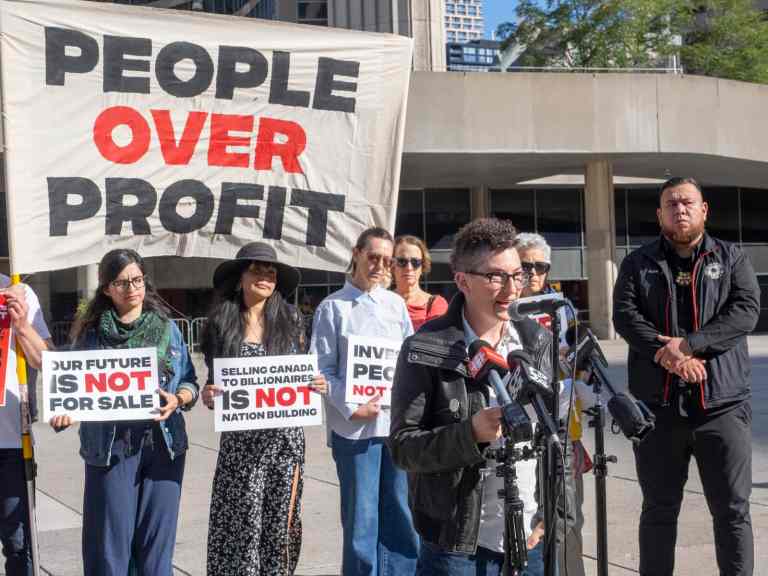 Protesters outside the Canada Investment Summit in Toronto